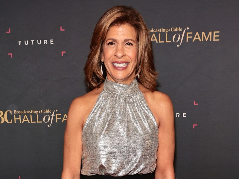 Hoda Kotb smiling wearing silver halter top