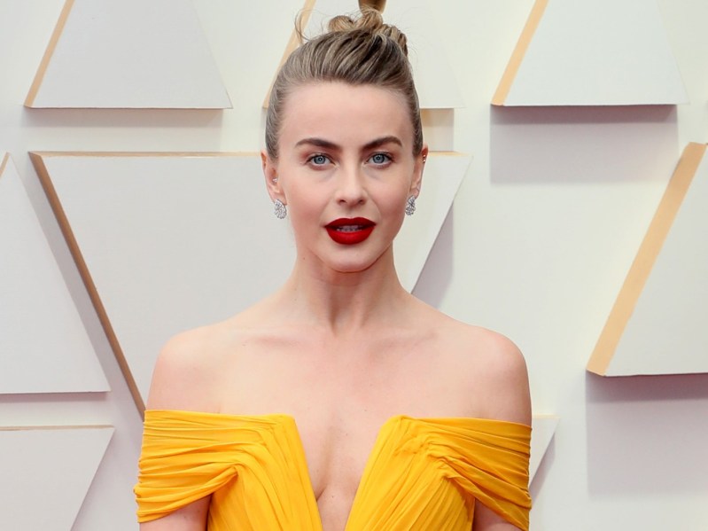 Julianne Hough wearing off-shoulder yellow dress with deep red lipstick and updo