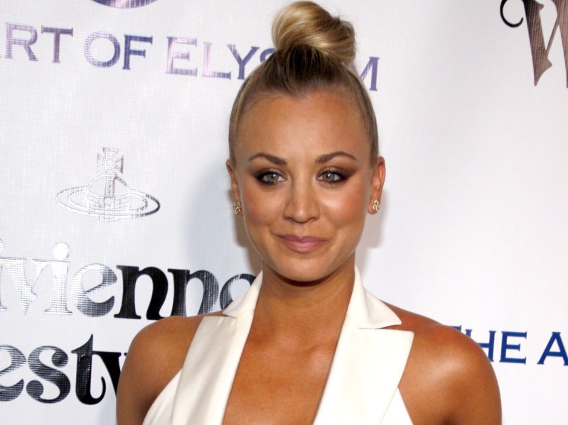 Closeup of Kaley Cuoco wearing top knot and white top
