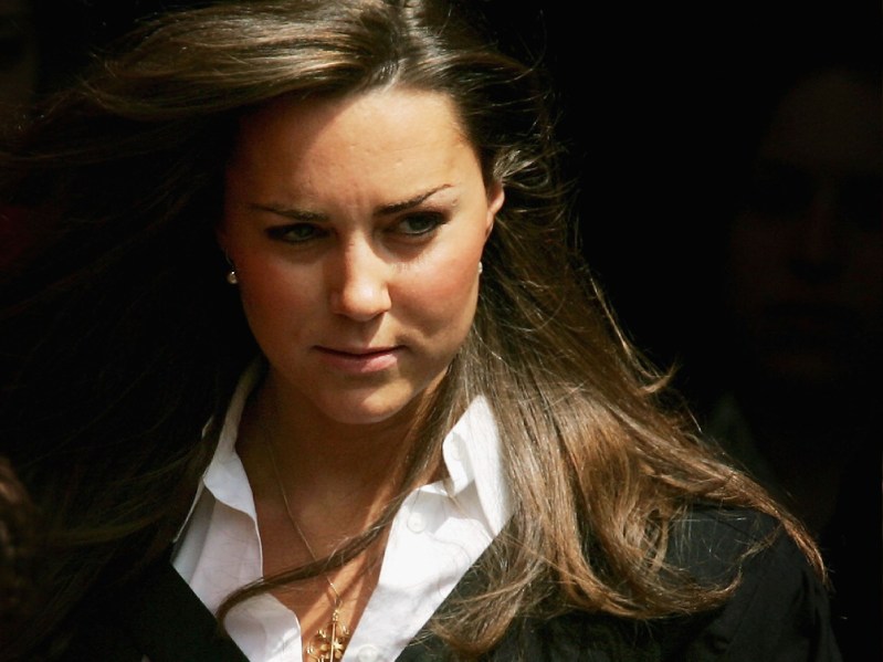 Kate Middleton wears a black robe as she exits her graduation ceremony