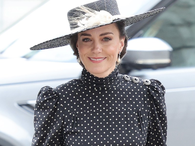 Kate Middleton wearing dress and hat