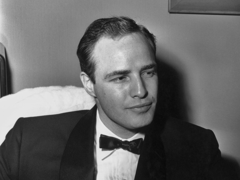 Black and white photo of Marlon Brando wearing suit and bowtie