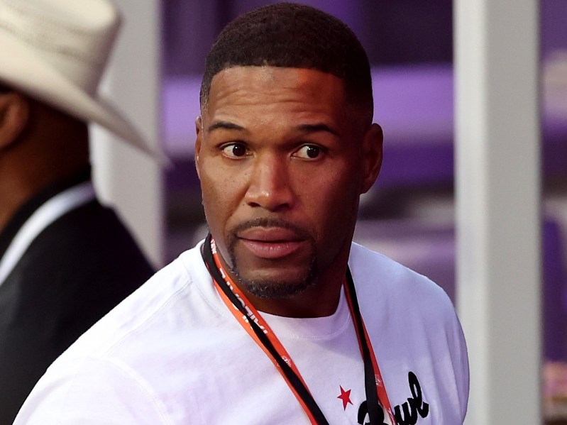 Michael Strahan wears a white tee shirt at the 2022 Super Bowl