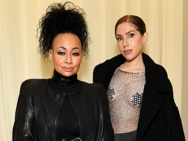 Raven-Symone (L) wearing black and Miranda Maday (R) wearing sheer top with black jacket