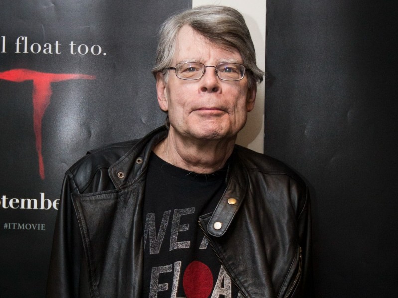 Stephen King wearing leather jacket and smiling