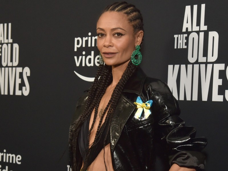 Thandiwe Newton wearing a black jacket and green earrings