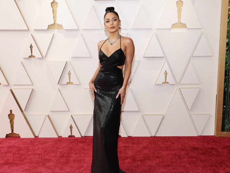 Vanessa Hudgens wears a black dress on the Oscars red carpet