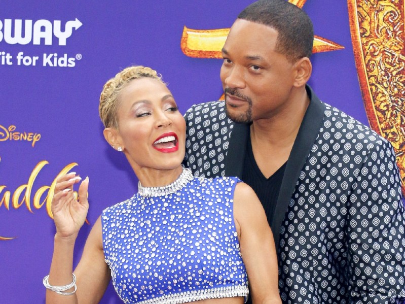 Jada Pinkett Smith and Will Smith stand together on the red carpet
