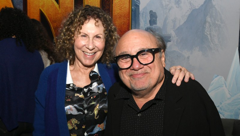 Rhea Perlman and Danny DeVito smiling together on the red carpet