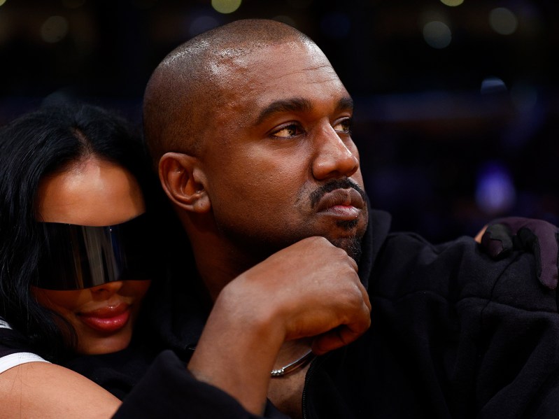 Kanye West takes in a baseketball game with Chaney Jones in March, amid ongoing divorce from Kim Kardashian(Photo by Ronald Martinez/Getty Images)