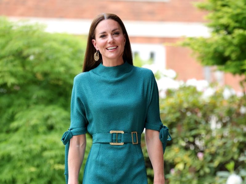 Kate Middelton smiling in a teal dress at the Design Museum on May 04, 2022 in London, England.