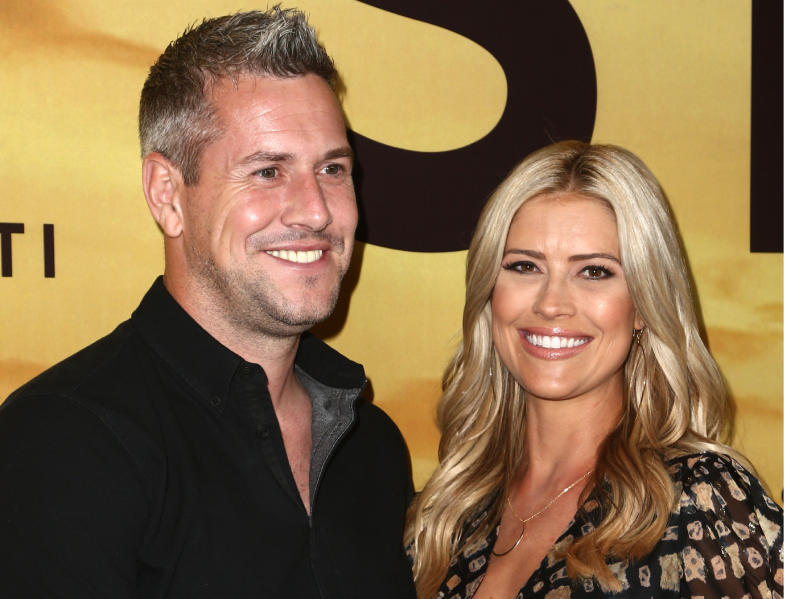 Ant Anstead (L) wearing black button-down shirt, standing next to Christina Haack (R) wearing patterned dress