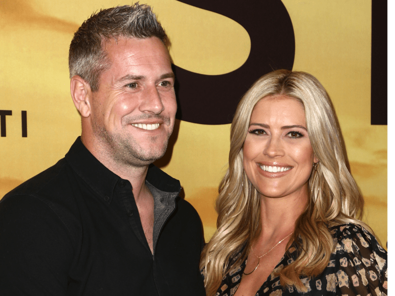 Ant Anstead (L) wearing black button-down shirt, standing next to Christina Haack (R) wearing patterned dress