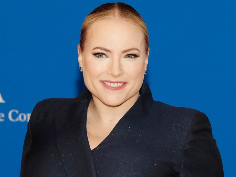 Meghan McCain smiles with slicked-back hair and a black, sparkly blazer