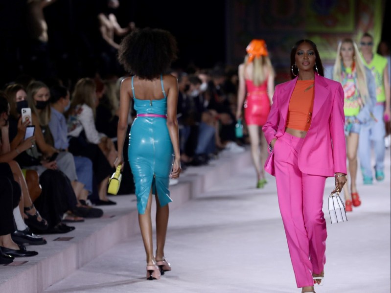 Models, including Naomi Cambell, walk the runway at a Versace fashion show