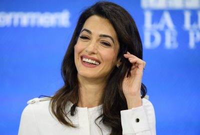 Close-up of Amal Clooney smiling at an event.