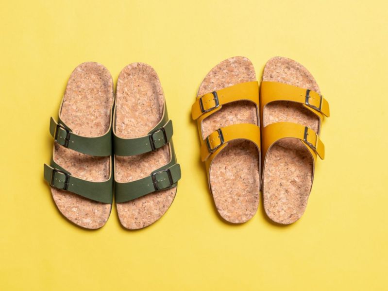 Leather slides on yellow background
