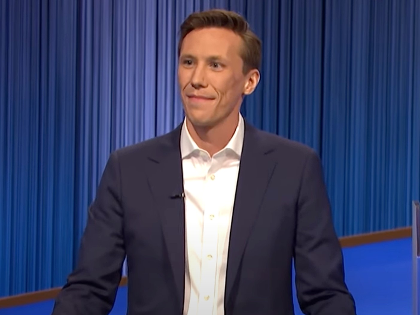 Eric Ahasic wearing white dress shirt and black blazer