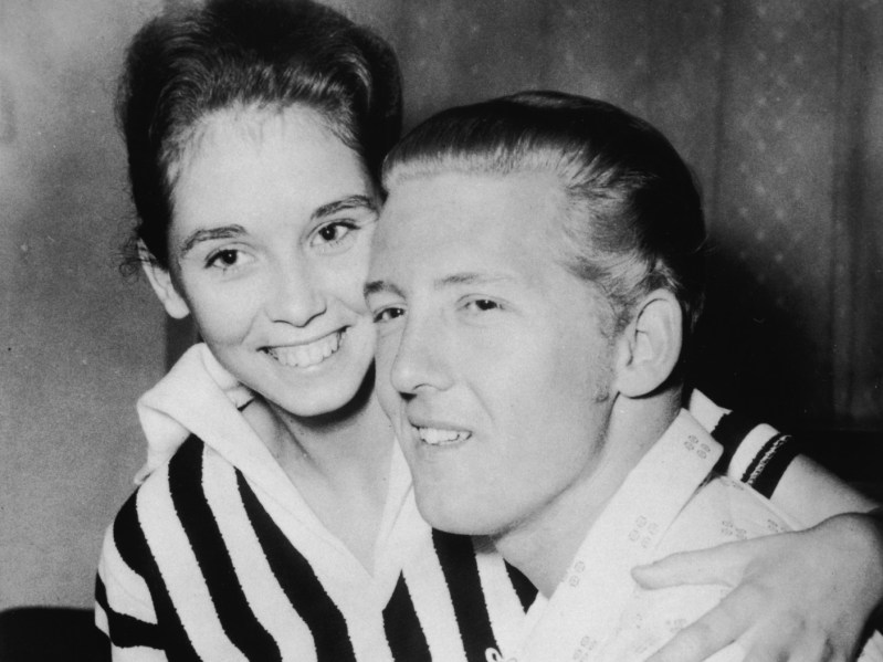 Myra Gail Brown (L) and Jerry Lee Lewis sitting close together and smiling