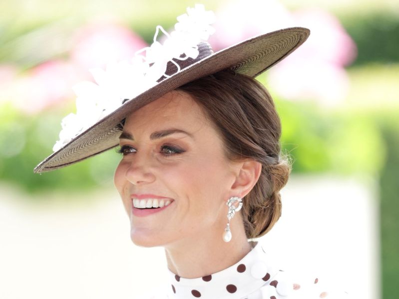 Kate Middleton side profile at Ascot in fascintor and white and black polka dot dress