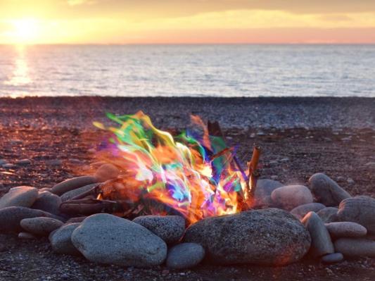 Campfire on the beach with Magical Flames making fire red, green, teal, yellow and orange