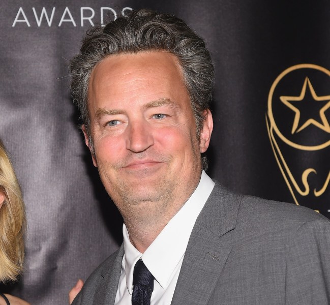 2017 close up of Matthew Perry smiling in a grey suit