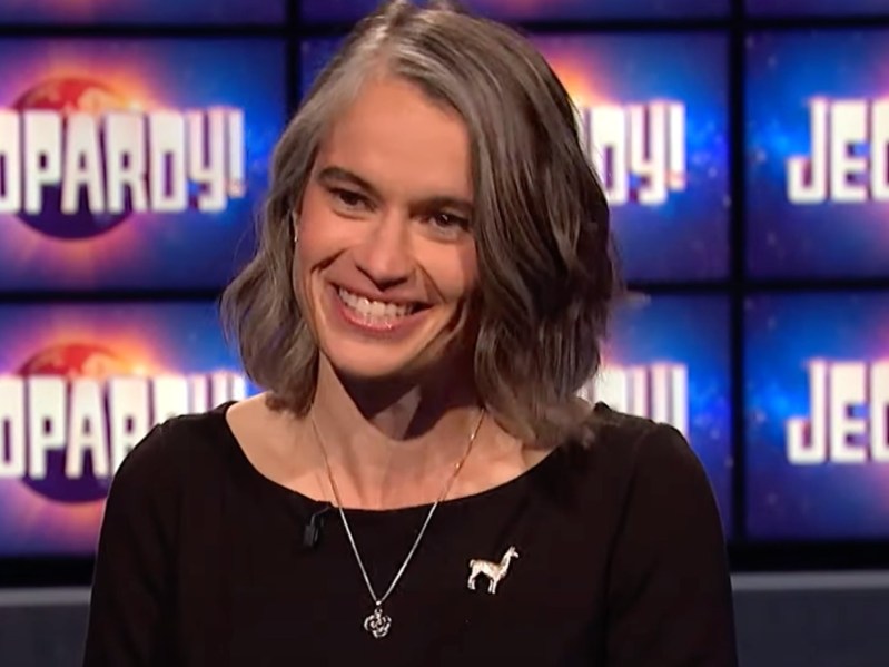 Megan Wachspress smiles while wearing a black top and silver necklace