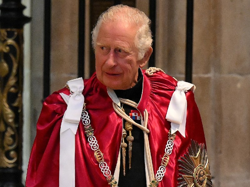 Prince Charles wears red ceremonial robes inside Westminster Abbey