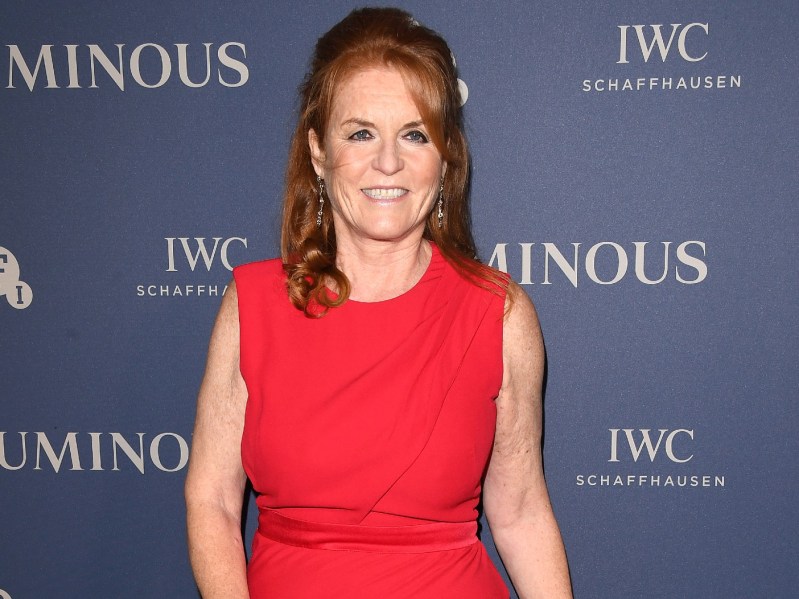 Sarah Ferguson smiles while wearing bright red gown