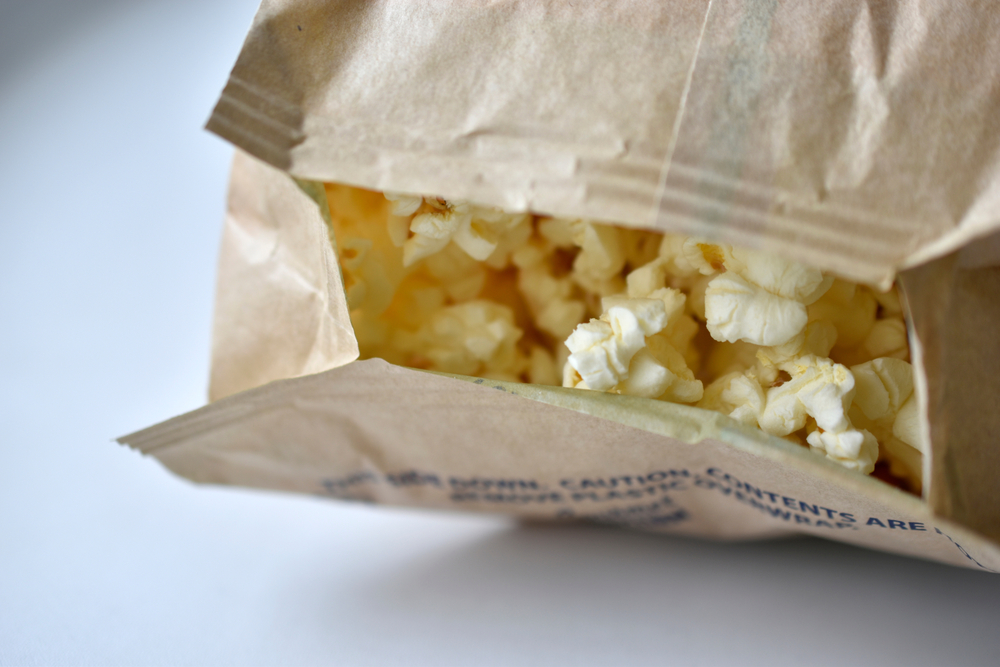 The Actual Dangers Of Microwave Popcorn, Plus Healthier Alternatives