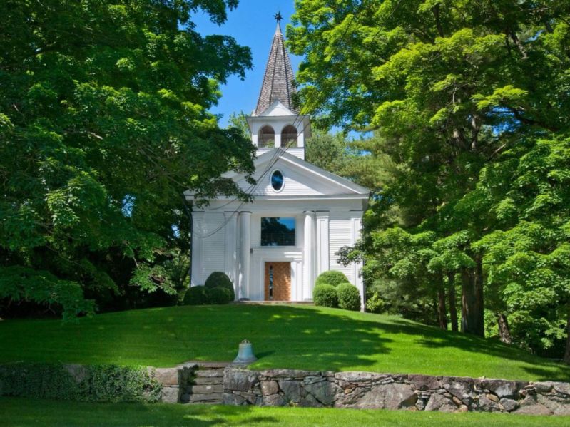 The front view of a New England church that was transformed into a modern home.