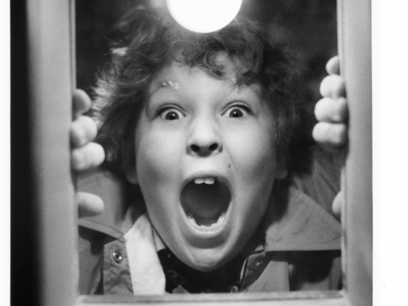 Black and white image of "Chunk" from "The Goonies" yelling