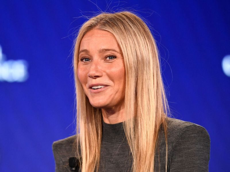 Gwyneth Paltrow smiling in a green dress