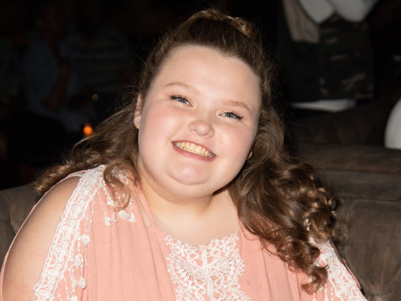 Closeup of Honey Boo Boo Alana Thompson wearing light coral shirt with white lace design