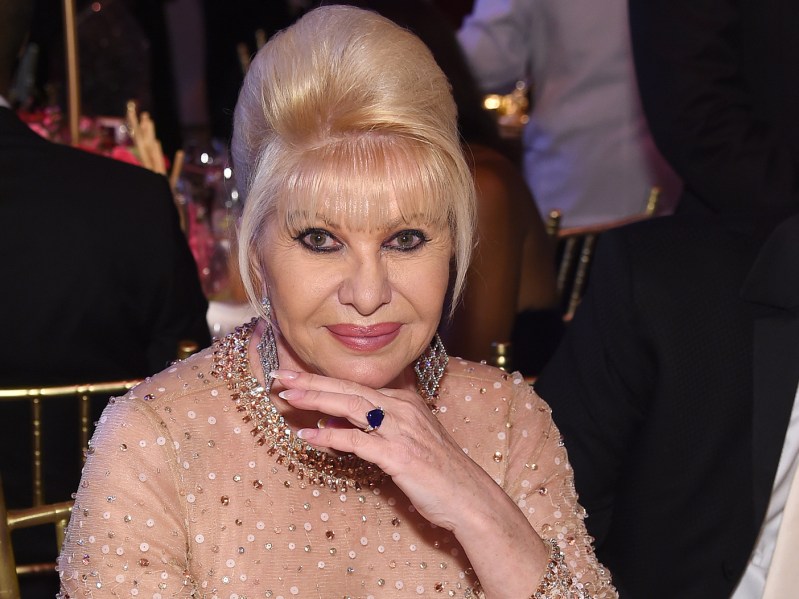 Ivana Trump smiling with her hand under her chin at a gala