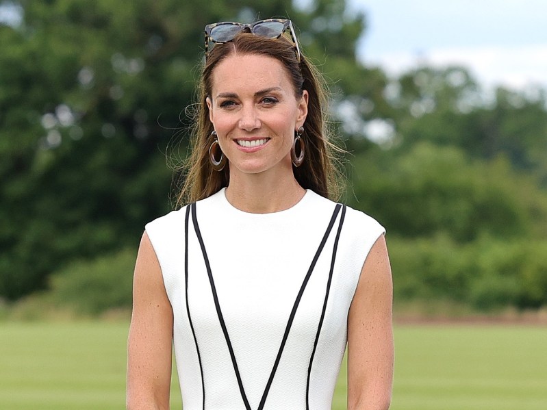 Kate Middleton wears a sleeveless white dress outdoors at a horse event