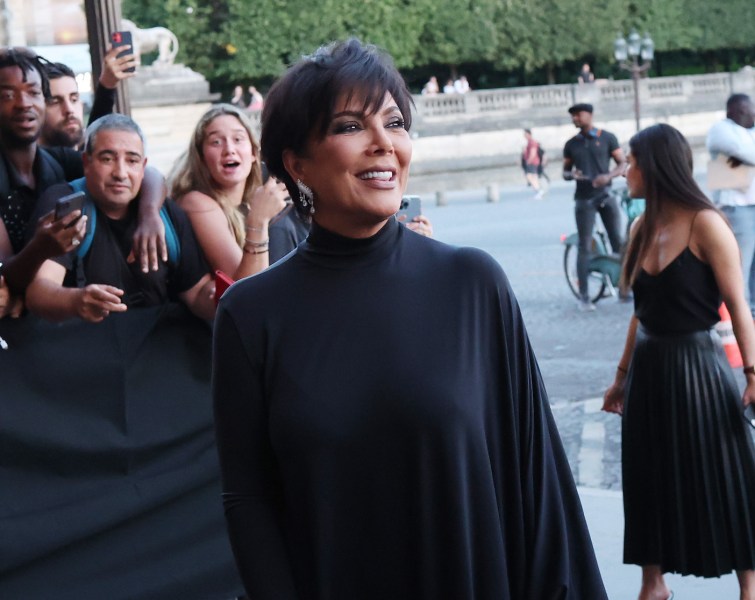 Kris Jenner in a black outfit outdoors