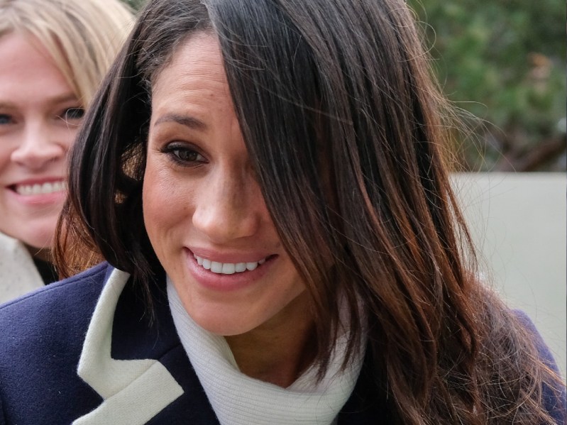 Meghan Markle wears a blue coat while greeting supporters outdoors