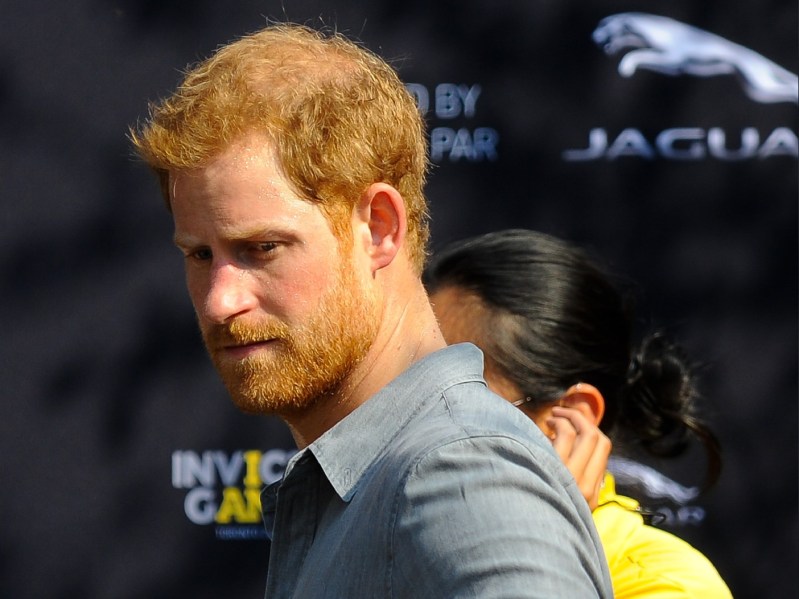 Prince Harry wears a blue shirt as he attends the Invictus Games