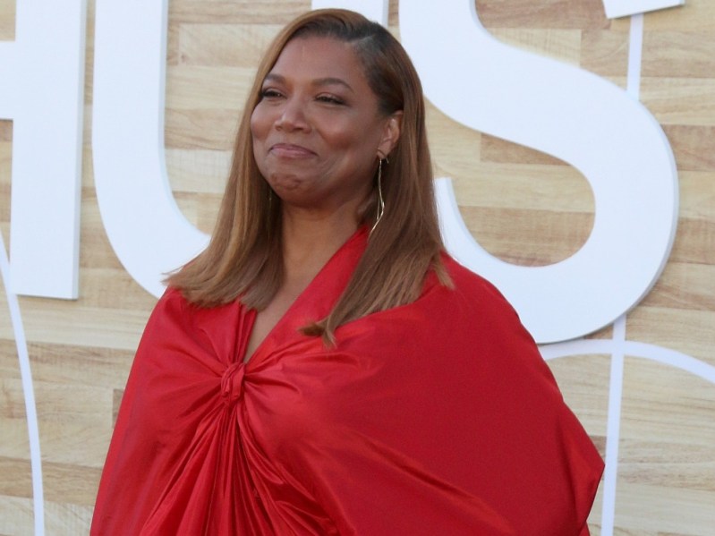 Queen Latifah wears a red ensemble on the red carpet