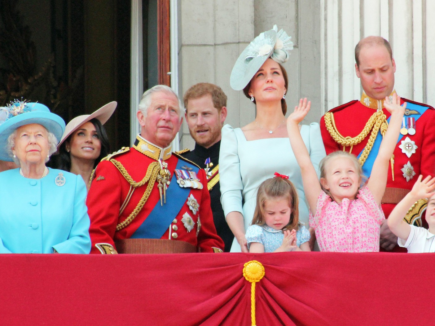 Queen Elizabeth and members of her family stand on the royal balcony