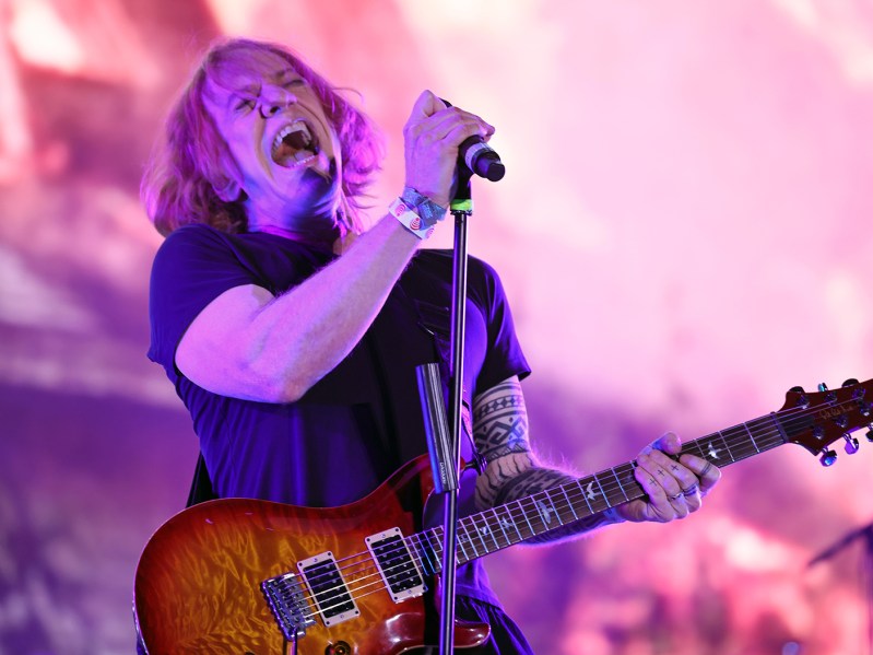 Danny Elfman on stage at Coachella 2022 singing and playing guitar