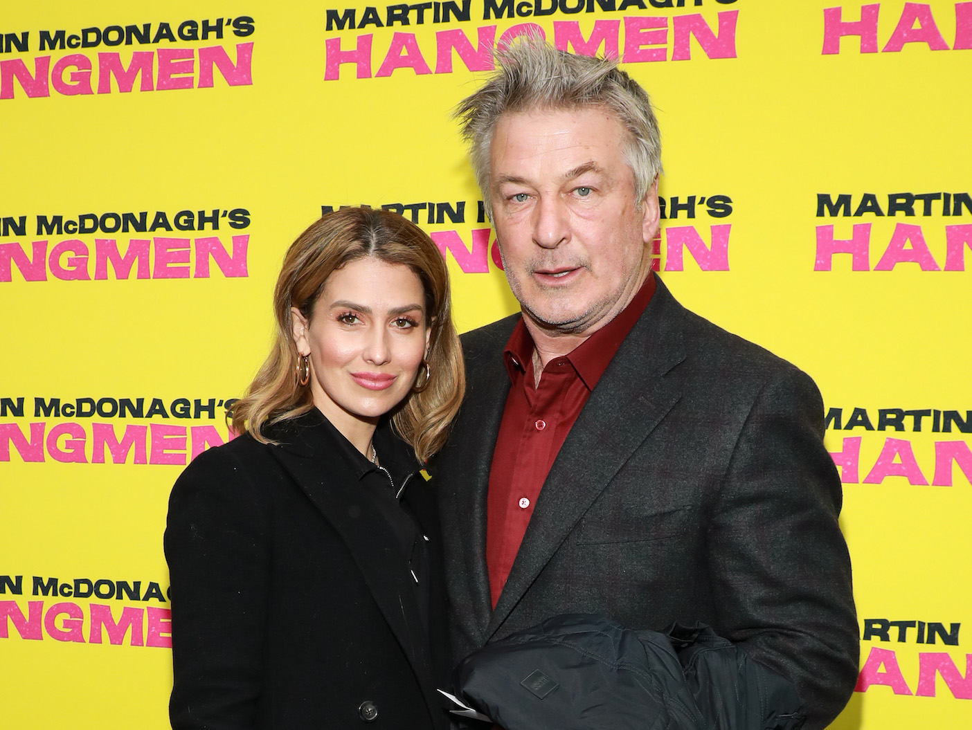 Alec Baldwin in a grey coat with wife Hilaria in a black coat