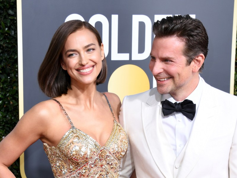 2020 photo of Bradley Cooper in a white tuxedo with Irina Shayk in a gold dress