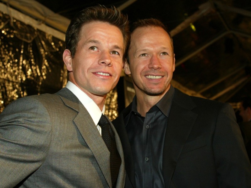 Mark Wahlberg (L) standing next to Donnie Wahlberg in a closeup shot