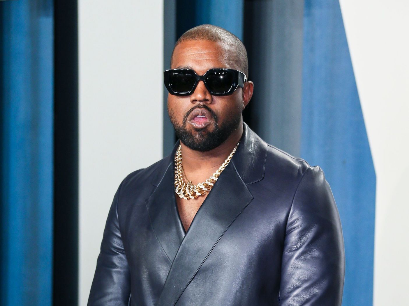 2020 photo of Kanye West in sunglasses and a black leather jacket