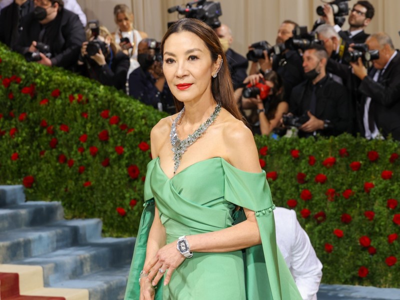 Michelle Yeoh smiles in green gown