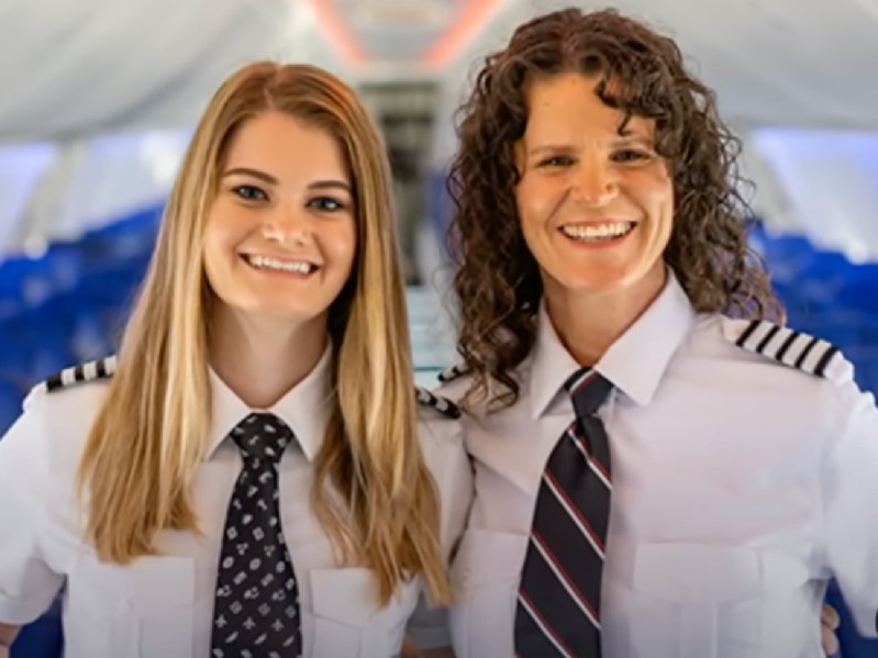 Keely Pettit (L) and her mother Holly smiling in matching pilot uniforms