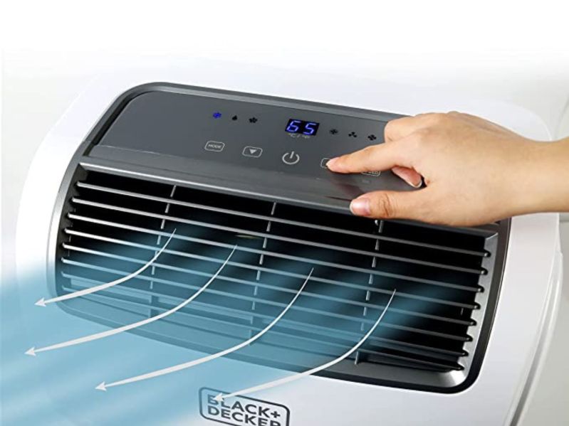 Person uses controls of Black + Decker portable A/C unit, cooling air graphic coming out of vent