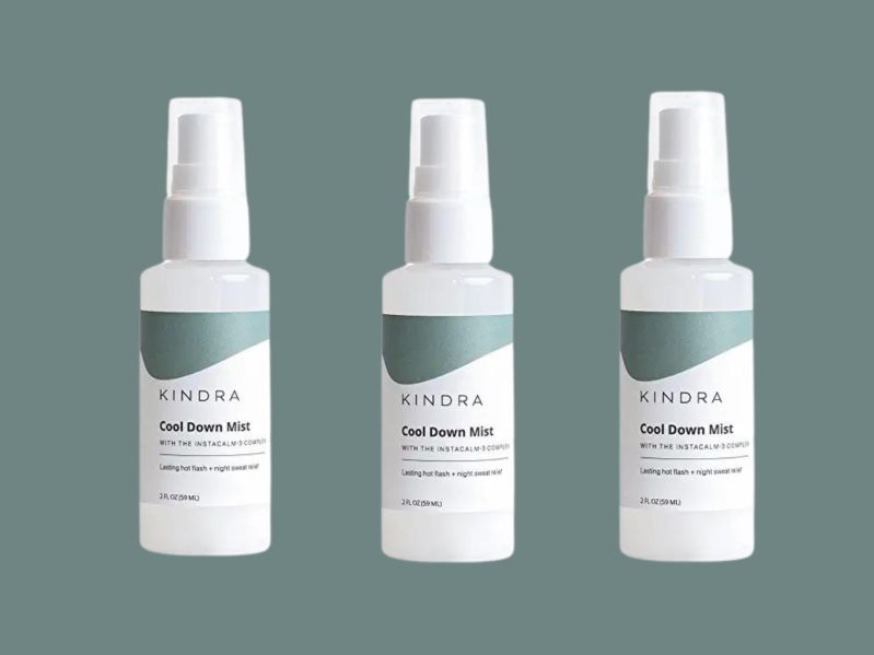 Three bottles of Kinda Cool Down Mist on an sage green background